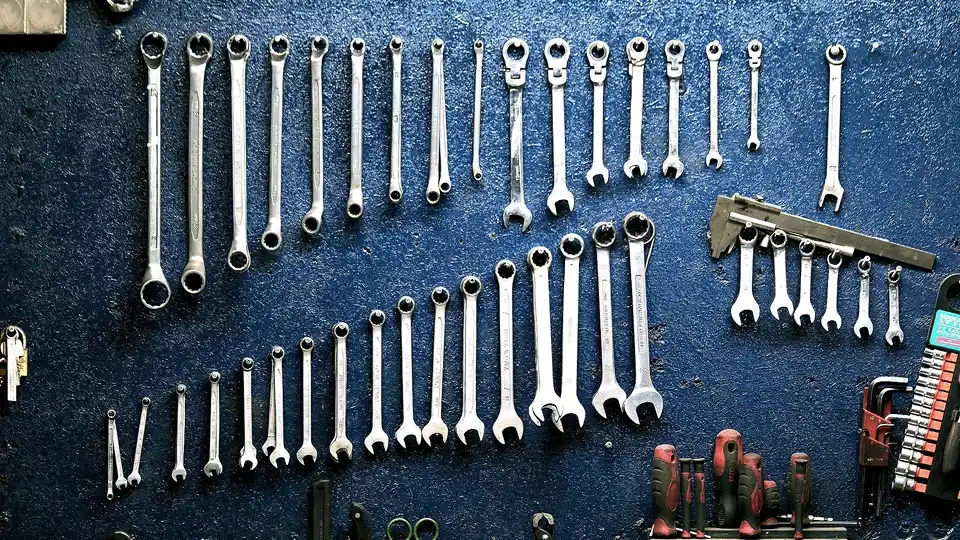 wrenches on wall pegs for storage