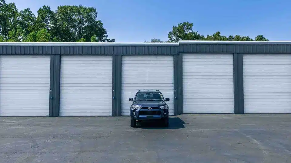 large storage unit with a car parked in front